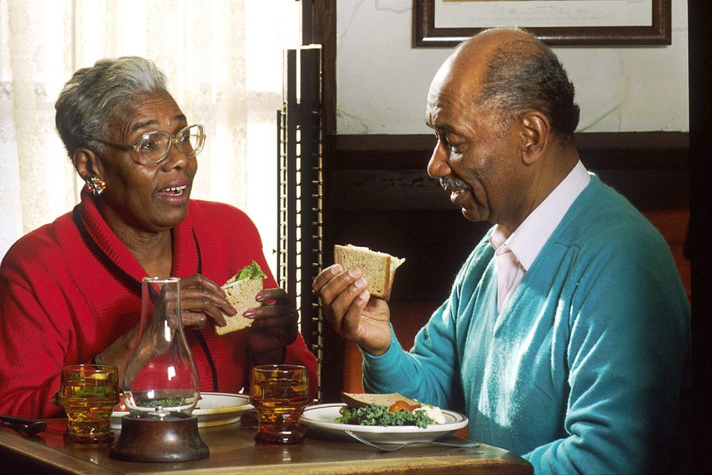 Retirement Gets Real: 5 Financial Decisions That Matter Most in Your 60s A senior couple smiling together at home in natural light