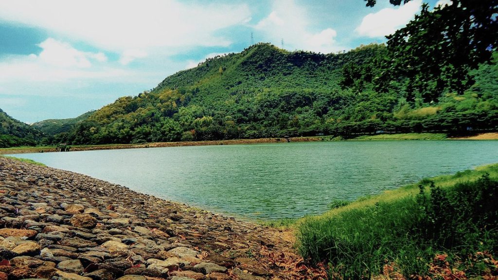 A reservoir and dam holding back blue water