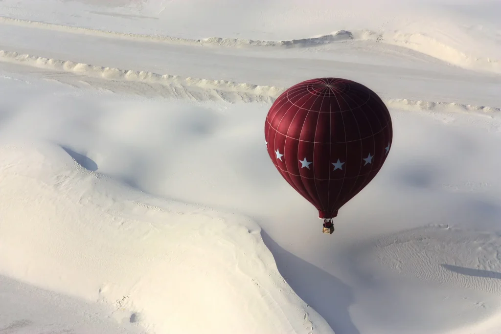 White Sands Study Shows Early Humans Endured Abrupt Climate Swings Hot air balloon drifting over the white gypsum dunes of White Sands in New Mexico
