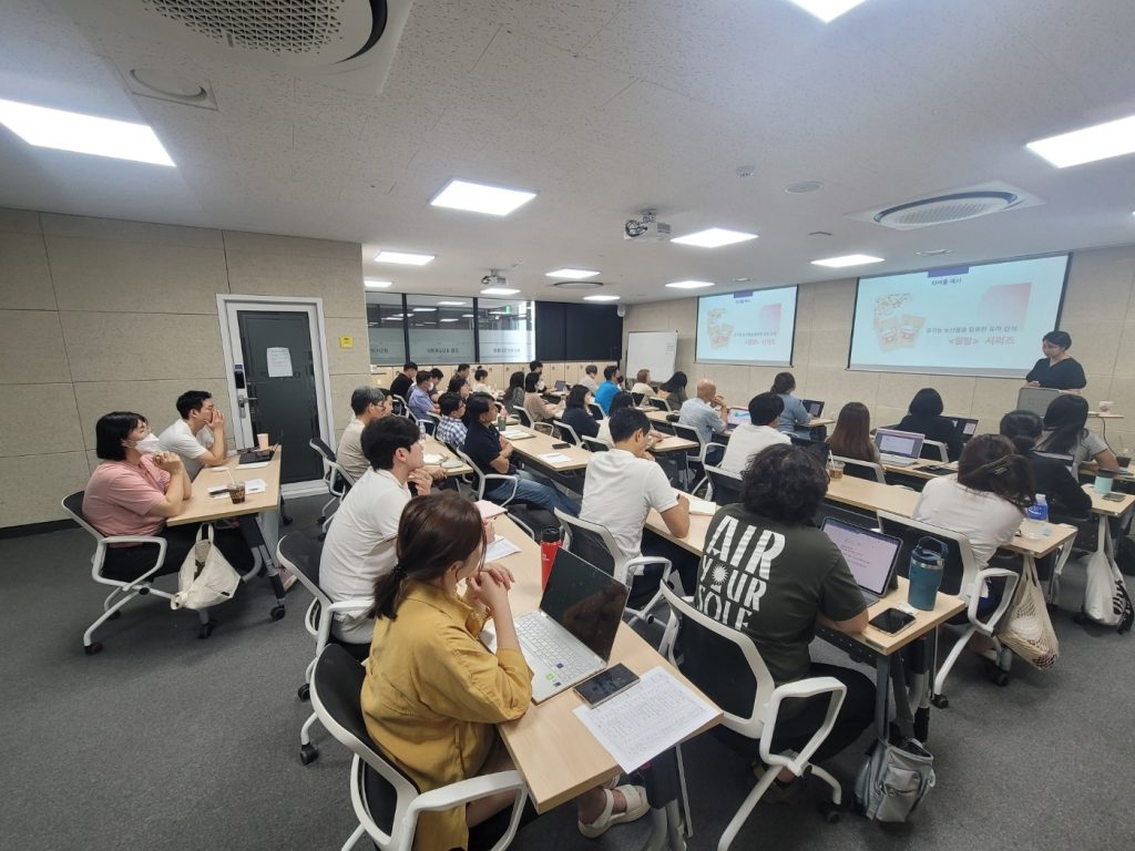 Phone-Free Classrooms Help Struggling Students Most, Study Shows Students in a phone-free classroom focusing on a lesson while smartphones stay put away
